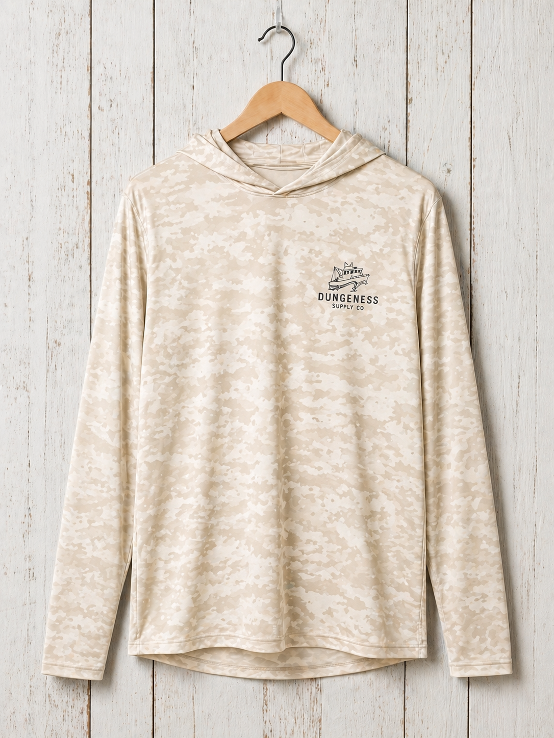 Cream and beige tie-dye hoodie with subtle embroidered Dungeness Supply Co. boat logo on the chest